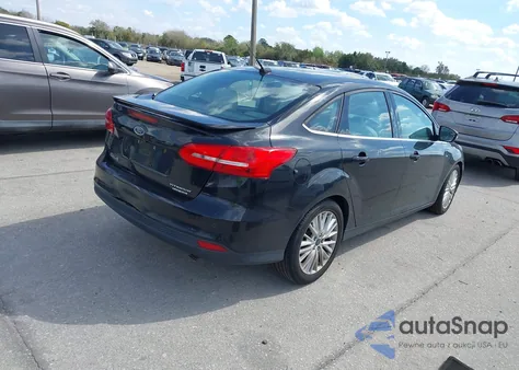 2015 Ford Focus Titanium z USA, uszkodzony, nr VIN 1FADP3J25FL338697